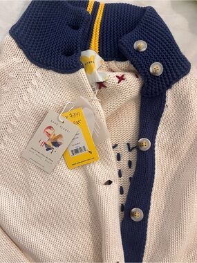 Cream Knit Sweater with Navy Heart and Multicolor Cross-Stitch Details